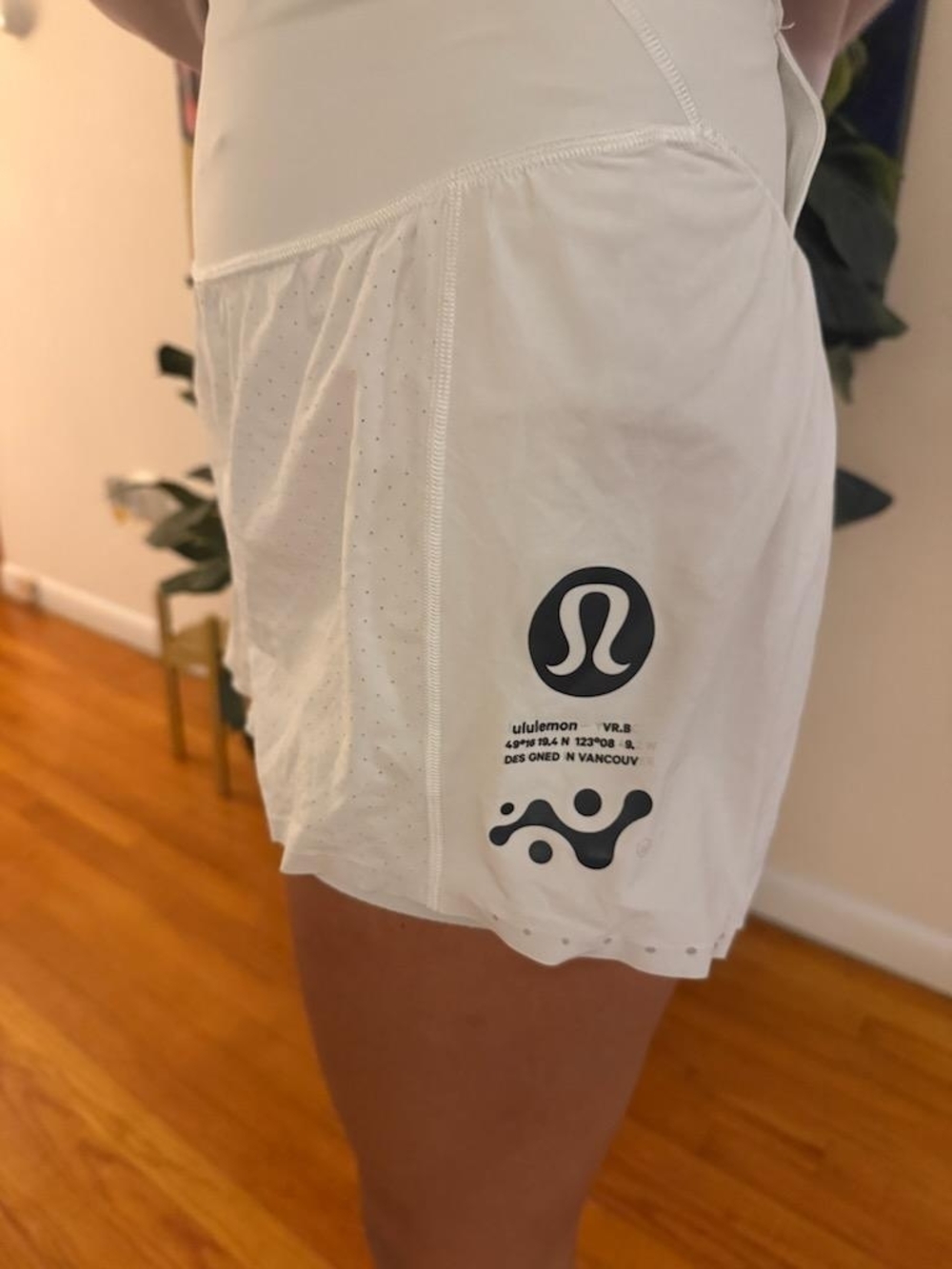 lululemon cream perforated athletic skort with logo tag